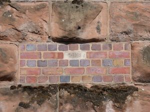 A small repair with 1915 date plaque